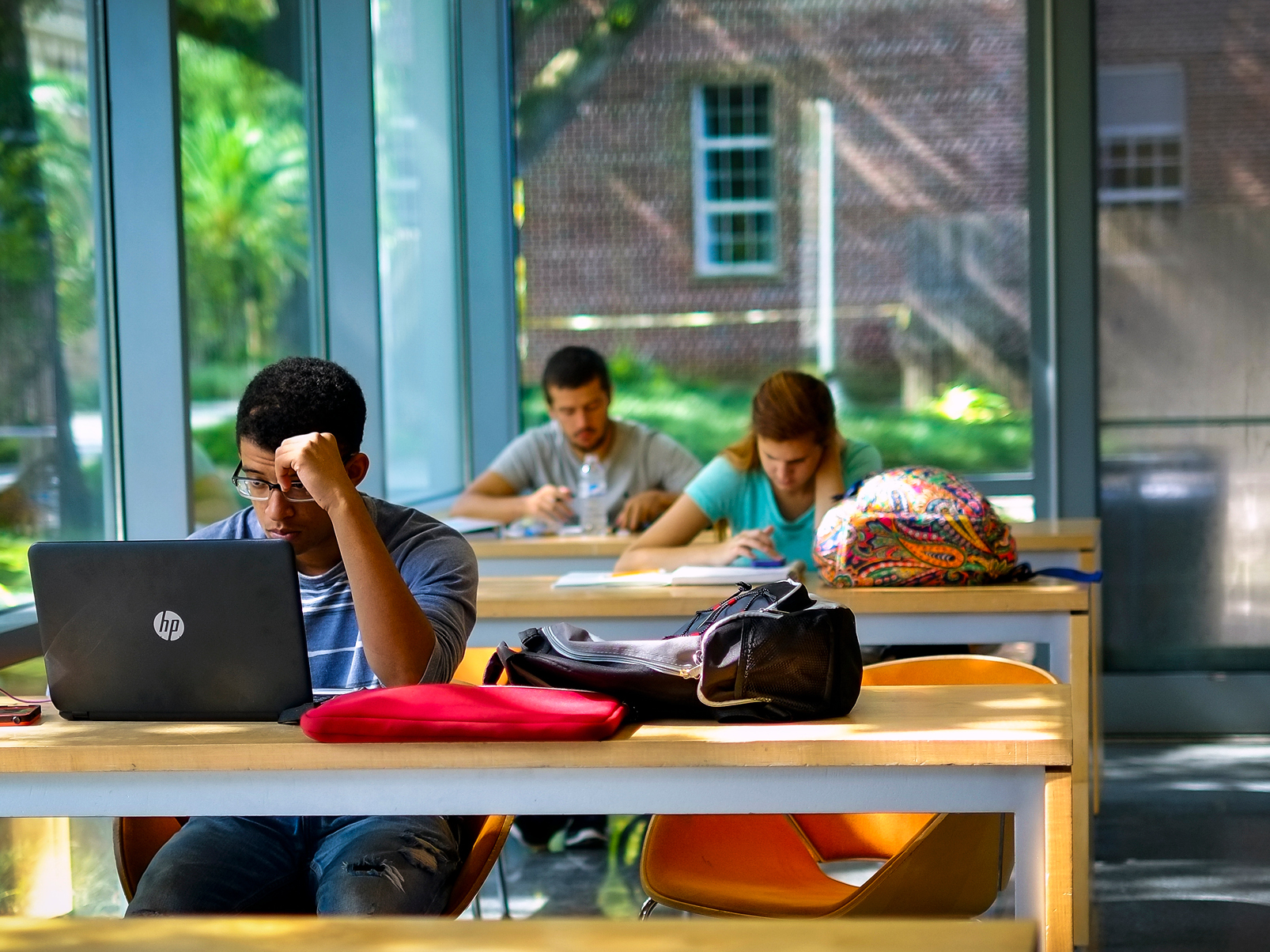 Students studying at tables in the Center for Student Life.